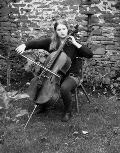 Looking like Rostropovich against the Berlin Wall. Not so much 'Berliner Mauer' as 'Neighbours rustic barn'.